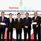 M Cora-signing-ceremony